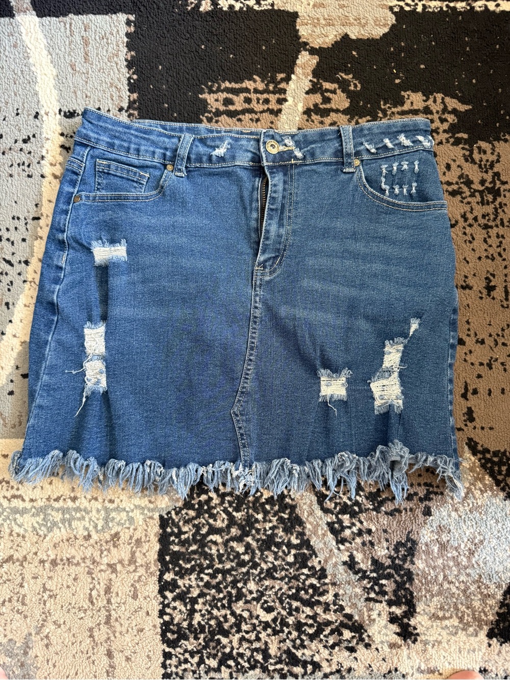 Distressed Blue Denim Mini Skirt with Frayed Hem